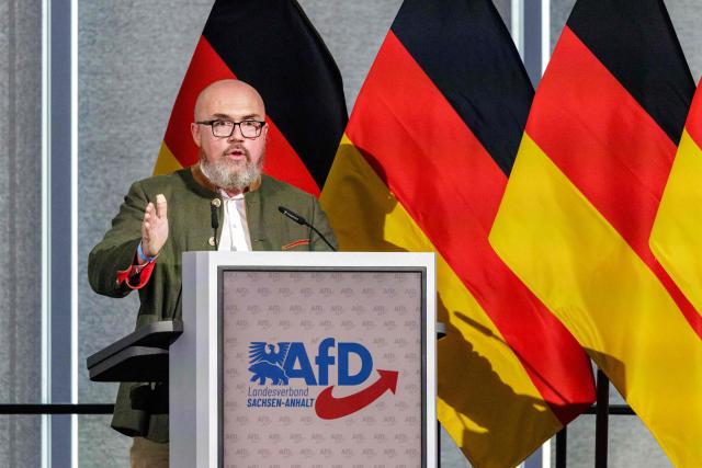 Hans-Thomas Tillschneider, member of the state parliament of Saxony-Anhalt and cultural policy spokesman for the regional parliamentary group of Germany's far-right Alternative for Germany (AfD) party, speaks to the delegates during the state party convention of the far-right Alternative for Germany party (AfD) in Magdeburg, eastern Germany on July 11, 2026. At its party conference, the AfD presented its 100-day programme for the period following the state election scheduled for September 6, 2026. (Photo by Jens SCHLÜTER / AFP)