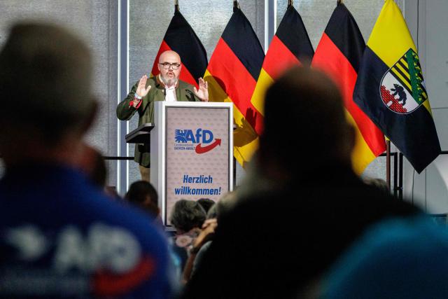 Hans-Thomas Tillschneider, member of the state parliament of Saxony-Anhalt and cultural policy spokesman for the regional parliamentary group of Germany's far-right Alternative for Germany (AfD) party, speaks to the delegates during the state party convention of the far-right Alternative for Germany party (AfD) in Magdeburg, eastern Germany on July 11, 2026. At its party conference, the AfD presented its 100-day programme for the period following the state election scheduled for September 6, 2026. (Photo by Jens SCHLÜTER / AFP)