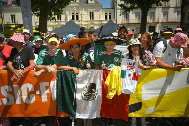 Fans in sombreros look on at the start of the 8th stage of the 113th edition of the Tour de France cycling race, 182 km between Périgueux and Bergerac in southwestern France, on July 11, 2026. (Photo by Loic VENANCE / AFP)