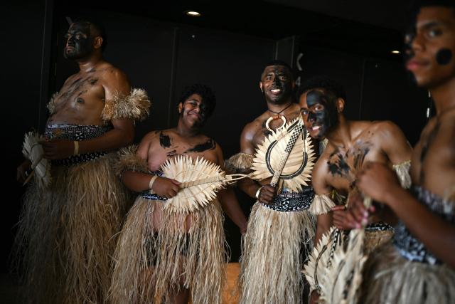 Fijians welcome supporters ahead of the Rugby Union Nations Championship match between Fiji and England at Hill Dickinson Stadium in Liverpool on July 11, 2026. (Photo by Oli SCARFF / AFP)
