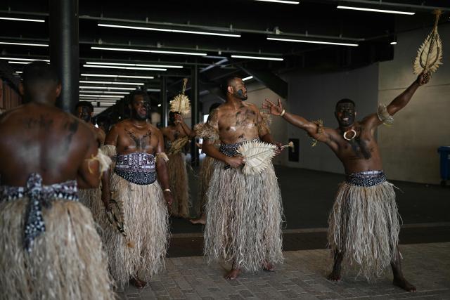 Fijians welcome supporters ahead of the Rugby Union Nations Championship match between Fiji and England at Hill Dickinson Stadium in Liverpool on July 11, 2026. (Photo by Oli SCARFF / AFP)
