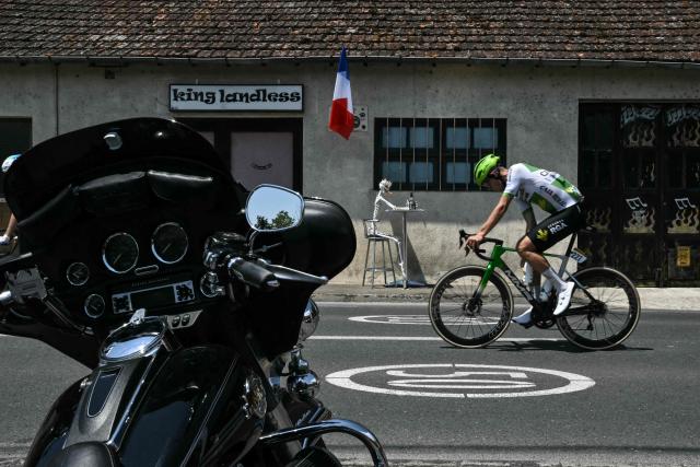 Caja Rural - Seguros RGA team's Czech rider Jakub Otruba cycles in a breakaway past a parked motorcycle during the 8th stage of the 113th edition of the Tour de France cycling race, 180,4 km between Perigueux and Bergerac in southwestern France, on July 11, 2026. (Photo by Jeff PACHOUD / AFP)