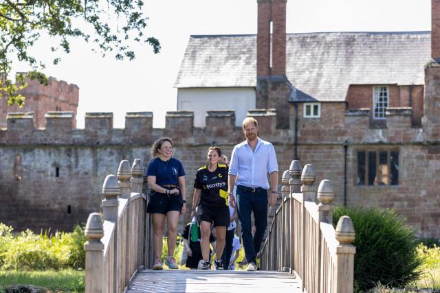 Britain's Prince Harry, Duke of Sussex, talks with founder of the charity Scotty's, Nikki Scott (C) and Brand Director at Sharky + George, Jean-Anne Russell as he attends 'Scotty's Summer Festival' at Maxstoke Castle near Birmingham, central England on July 11, 2026. (Photo by Heathcliff O'MALLEY / POOL / AFP)