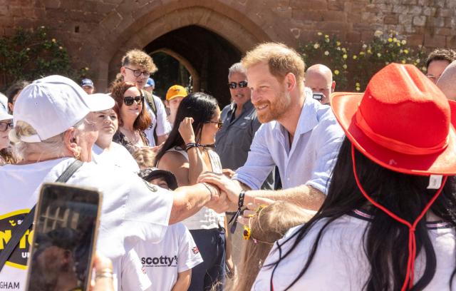 Britain's Prince Harry, Duke of Sussex, meets well-wishers as he attends 'Scotty's Summer Festival' at Maxstoke Castle near Birmingham, central England on July 11, 2026. (Photo by Heathcliff O'MALLEY / POOL / AFP)