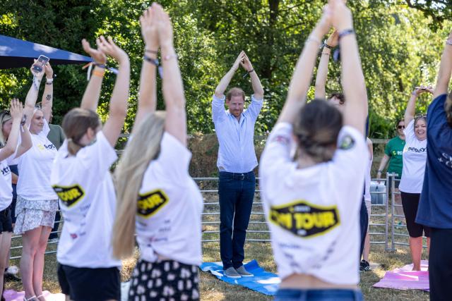 Britain's Prince Harry, Duke of Sussex, reacts as he takes part in a 'Goat Yoga' class as he attends 'Scotty's Summer Festival' at Maxstoke Castle near Birmingham, central England on July 11, 2026. (Photo by Heathcliff O'MALLEY / POOL / AFP)
