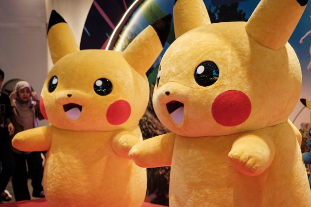 Two Pikachu mascots pose for a photograph during 'Pokemon GO Fest: Global', a worldwide event marking the 10th anniversary of Pokemon GO, an augmented reality mobile game, at Agora Mall in Jakarta on July 11, 2026. (Photo by YASUYOSHI CHIBA / AFP)