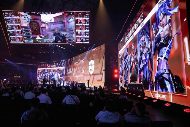 Spectators look at teams 100 Thieves and NongShim RedForce playing Valorant during the 2026 Esports World Cup at the Paris Expo Porte de Versailles venue in Paris, on July 11, 2026. (Photo by Thomas SAMSON / AFP)