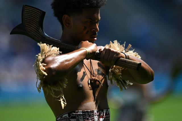 People perform on the pitch ahead of the Rugby Union Nations Championship match between Fiji and England at Hill Dickinson Stadium in Liverpool on July 11, 2026. (Photo by Oli SCARFF / AFP)