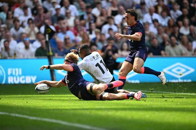 England's Henry Pollock scores the team's eighth try during the Rugby Union Nations Championship match between Fiji and England at Hill Dickinson Stadium in Liverpool on July 11, 2026. (Photo by Oli SCARFF / AFP)