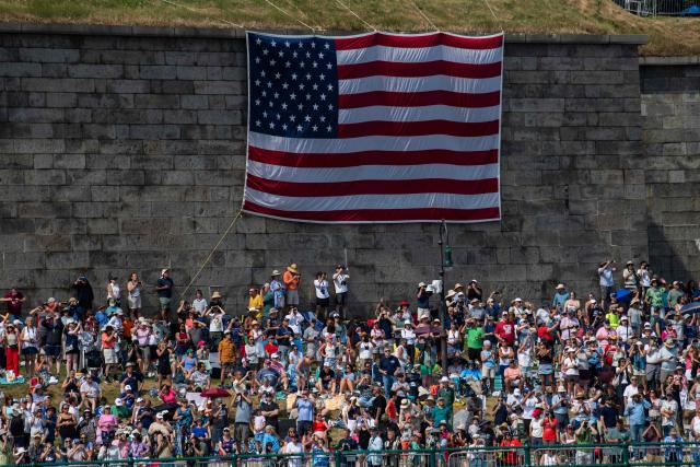 People gather on Castle Island to watch the Sail Boston Parade of Sail in Boston Harbor in Boston, Massachusetts on July 11, 2026. (Photo by Joseph Prezioso / AFP)