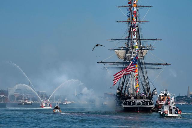 The USS Constitution ("Old Ironsides") fires its canons as it sails around Castle Island during the Sail Boston Parade of Sail in Boston Harbor in Boston, Massachusetts on July 11, 2026. (Photo by Joseph Prezioso / AFP)