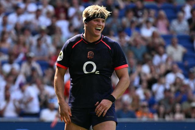 England's Henry Pollock celebrates after scoring the team's eleventh try, his hat-trick, during the Rugby Union Nations Championship match between Fiji and England at Hill Dickinson Stadium in Liverpool on July 11, 2026. (Photo by Oli SCARFF / AFP)
