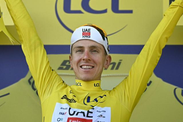UAE Team Emirates - XRG's Slovenian rider Tadej Pogacar celebrates on the podium with the overall leader's yellow jersey after the 8th stage of the 113th edition of the Tour de France cycling race, 182 km between Périgueux and Bergerac in southwestern France, on July 11, 2026. (Photo by Loic VENANCE / AFP)