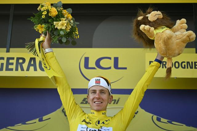 UAE Team Emirates - XRG's Slovenian rider Tadej Pogacar celebrates on the podium with the overall leader's yellow jersey after the 8th stage of the 113th edition of the Tour de France cycling race, 182 km between Périgueux and Bergerac in southwestern France, on July 11, 2026. (Photo by Loic VENANCE / AFP)