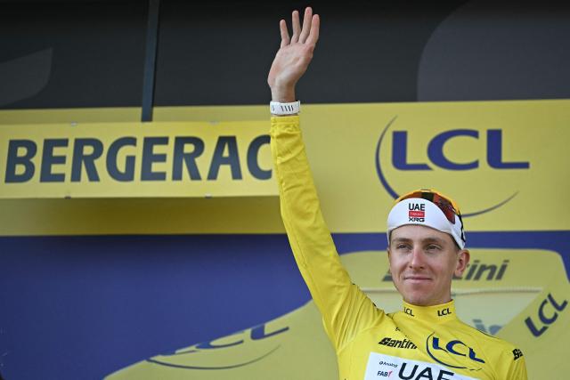 UAE Team Emirates - XRG's Slovenian rider Tadej Pogacar celebrates on the podium with the overall leader's yellow jersey after the 8th stage of the 113th edition of the Tour de France cycling race, 182 km between Périgueux and Bergerac in southwestern France, on July 11, 2026. (Photo by Loic VENANCE / AFP)
