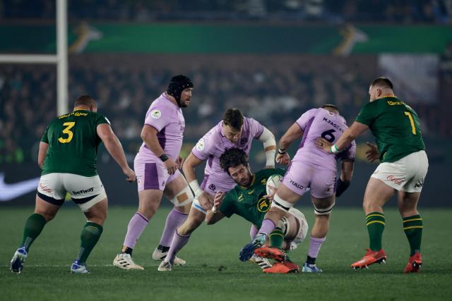 South Africa's lock Ruan Nortje (3rd R) is challenged by Scotland's flanker Matt Fagerson (2nd R) during the rugby Nations Championship match between South Africa and Scotland at Loftus Versfeld Stadium in Pretoria on July 11, 2026. (Photo by PHILL MAGAKOE / AFP)