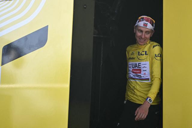 UAE Team Emirates - XRG's Slovenian rider Tadej Pogacar celebrates on the podium with the overall leader's yellow jersey after the 8th stage of the 113th edition of the Tour de France cycling race, 182 km between Périgueux and Bergerac in southwestern France, on July 11, 2026. (Photo by Loic VENANCE / AFP)