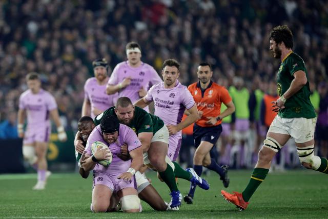 Scotland's prop Zander Fagerson is tackled by South Africa's prop Wilco Louw and South Africa's fullback Aphelele Fassi during the rugby Nations Championship match between South Africa and Scotland at Loftus Versfeld Stadium in Pretoria on July 11, 2026. (Photo by PHILL MAGAKOE / AFP)