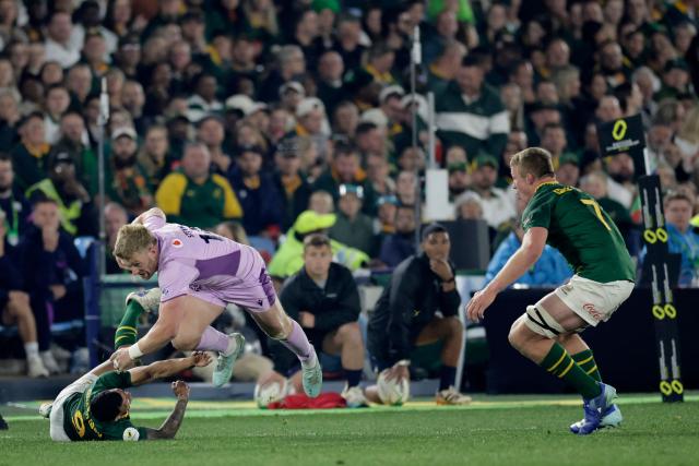 Scotland's wing Kyle Steyn (C) is tackled by South Africa's scrum-half Embrose Papier during the rugby Nations Championship match between South Africa and Scotland at Loftus Versfeld Stadium in Pretoria on July 11, 2026. (Photo by PHILL MAGAKOE / AFP)