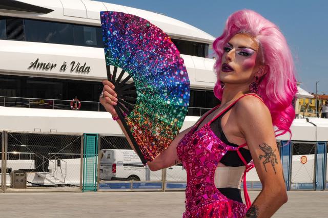 A participant poses during the "Pink Parade", a Pride parade in Nice, southeastern France on July 11, 2026. (Photo by Valery HACHE / AFP)
