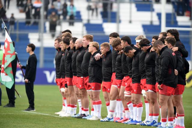 Wales players line up during the national anthem before the Rugby Union Nations Championship match between Argentina and Wales at San Juan del Bicentenario Stadium in San Juan, Argentina, on July 11, 2026. (Photo by Andres LARROVERE / AFP)