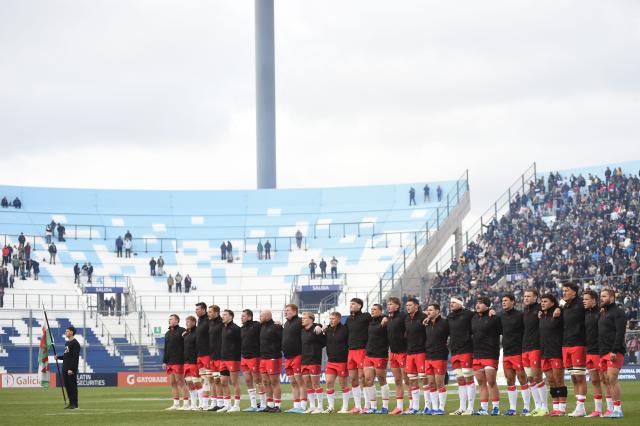 Wales players line up during the national anthem before the Rugby Union Nations Championship match between Argentina and Wales at San Juan del Bicentenario Stadium in San Juan, Argentina, on July 11, 2026. (Photo by Andres LARROVERE / AFP)