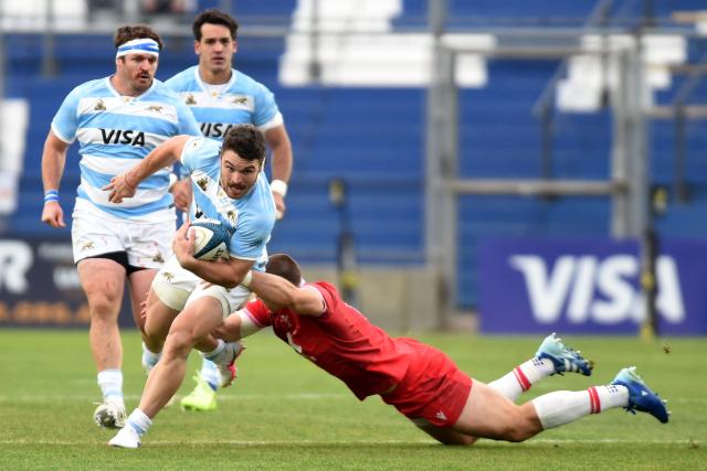 Argentina's wing Mateo Carreras is tackled by Wales' centre Joe Hawkins during the Rugby Union Nations Championship match between Argentina and Wales at San Juan del Bicentenario stadium in San Juan, Argentina, on July 11, 2026. (Photo by Andres LARROVERE / AFP)
