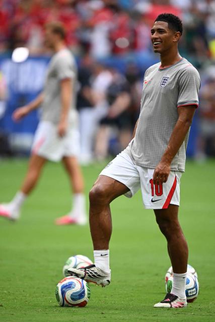 England's midfielder #10 Jude Bellingham smiles as he warms up ahead of the 2026 World Cup football tournament quarter-final match between Norway and England at Miami Stadium in Miami Gardens on July 11, 2026.  (Photo by MAURO PIMENTEL / AFP)