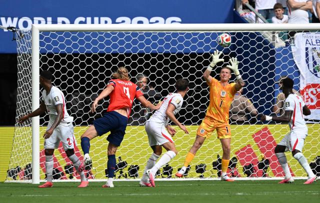 England's goalkeeper #01 Jordan Pickford makes a save on a header by Norway's forward #09 Erling Braut Haaland during the 2026 World Cup football tournament quarter-final match between Norway and England at Miami Stadium in Miami on July 11, 2026.  (Photo by ROBERTO SCHMIDT / AFP)