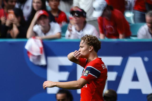 Norway's midfielder #21 Andreas Schjelderup reacts after scoring his team's first goal during the 2026 World Cup football tournament quarter-final match between Norway and England at Miami Stadium in Miami Gardens on July 11, 2026.  (Photo by PATRICIA DE MELO MOREIRA / AFP)