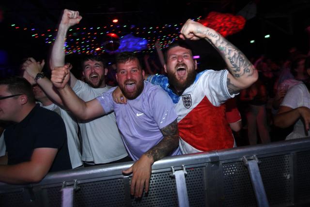 England fans react to Bellingham's late first half equalizer while watching the 2026 World Cup quarter-final football match between England and Norway, at Camp and Furnace in Liverpool, north-west England on July 11, 2026. (Photo by PETER POWELL / AFP)