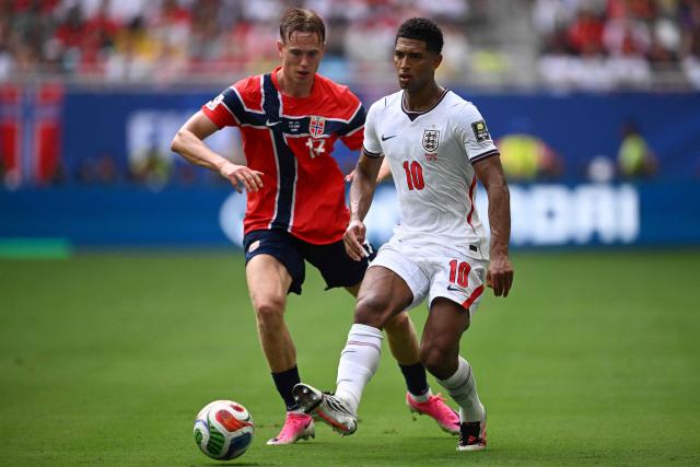 England's midfielder #10 Jude Bellingham kicks the ball past Norway's defender #17 Torbjorn Heggem during the 2026 World Cup football tournament quarter-final match between Norway and England at Miami Stadium in Miami Gardens on July 11, 2026.  (Photo by MAURO PIMENTEL / AFP)