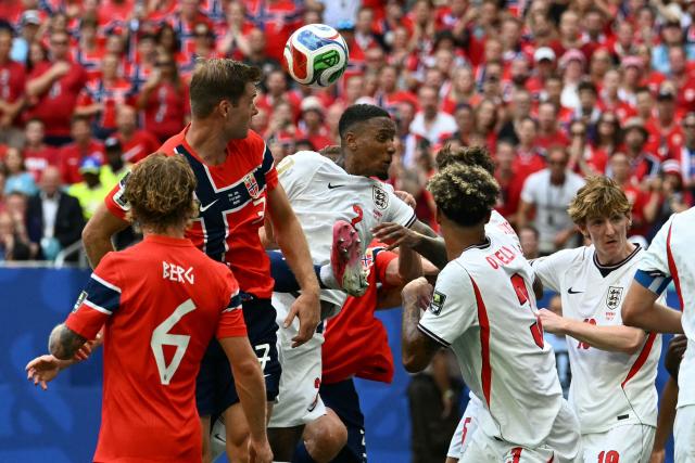England's defender #02 Ezri Konsa and Norway's forward #07 Alexander Sorloth go for a header during the 2026 World Cup football tournament quarter-final match between Norway and England at Miami Stadium in Miami on July 11, 2026.  (Photo by ROBERTO SCHMIDT / AFP)