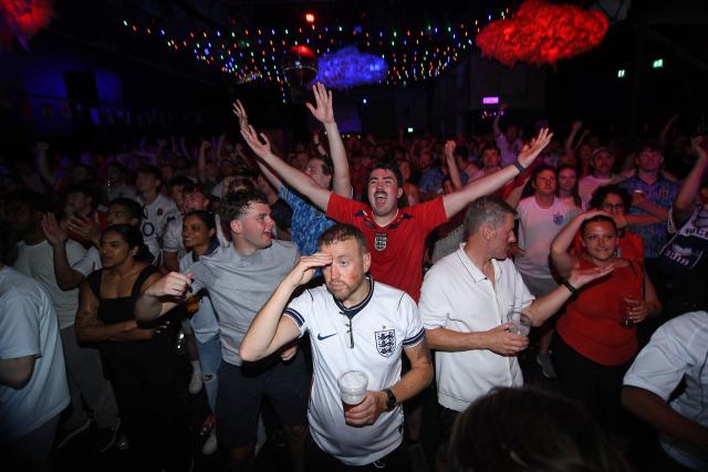 England fans react to Norway having a goal disallowed after a VAR (Video Assistant Referee) review while watching the 2026 World Cup quarter-final football match between England and Norway, at Camp and Furnace in Liverpool, north-west England on July 11, 2026. (Photo by PETER POWELL / AFP)