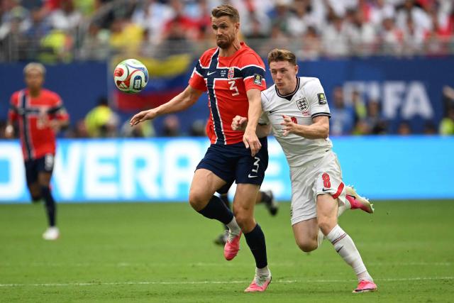 Norway's defender #03 Kristoffer Vassbakk Ajer and England's midfielder #08 Elliot Anderson fight for the ball during the 2026 World Cup football tournament quarter-final match between Norway and England at Miami Stadium in Miami Gardens on July 11, 2026.  (Photo by MAURO PIMENTEL / AFP)