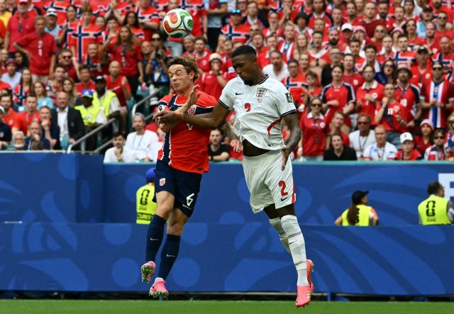 Norway's midfielder #06 Patrick Berg (L) and England's defender #02 Ezri Konsa fight for a header during the 2026 World Cup football tournament quarter-final match between Norway and England at Miami Stadium in Miami on July 11, 2026.  (Photo by ROBERTO SCHMIDT / AFP)