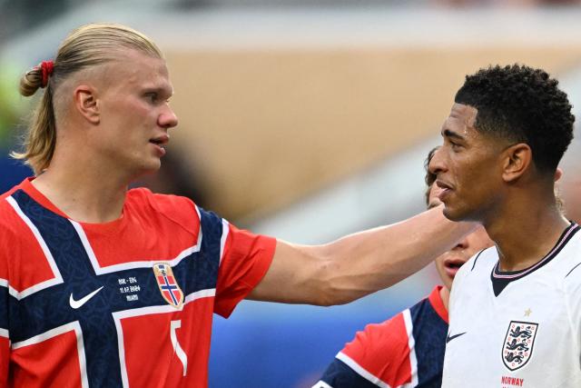 Norway's forward #09 Erling Braut Haaland (L) congratulates England's midfielder #10 Jude Bellingham for scoring his team's second goal during the 2026 World Cup football tournament quarter-final match between Norway and England at Miami Stadium in Miami on July 11, 2026.  (Photo by ROBERTO SCHMIDT / AFP)