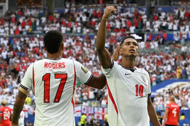 England's midfielder #10 Jude Bellingham celebrates with England's midfielder #17 Morgan Rogers after scoring his team's second goal during the 2026 World Cup football tournament quarter-final match between Norway and England at Miami Stadium in Miami on July 11, 2026.  (Photo by ROBERTO SCHMIDT / AFP)