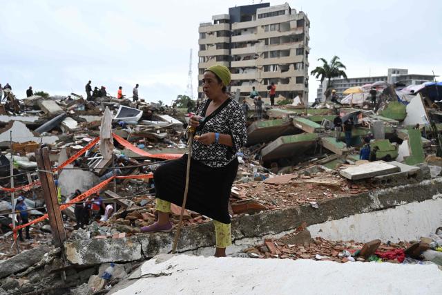 A resident stands amid the rubble of collapsed buildings in Caraballeda, La Guaira state, Venezuela, on July 11, 2026, following twin earthquakes that struck the region. The death toll from the twin earthquakes that struck Venezuela on June 24 has risen to more than 4,300, National Assembly President Jorge Rodriguez said on July 11. (Photo by Raul ARBOLEDA / AFP)