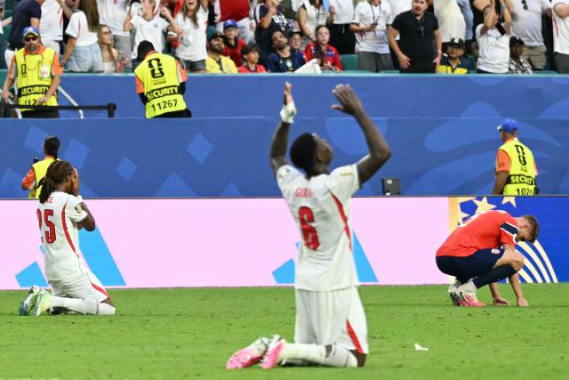 England's defender #25 Djed Spence (L) and Norway's defender #03 Kristoffer Vassbakk Ajer (R) react after the 2026 World Cup football tournament quarter-final match between Norway and England at Miami Stadium in Miami Gardens on July 11, 2026.  (Photo by CHANDAN KHANNA / AFP)