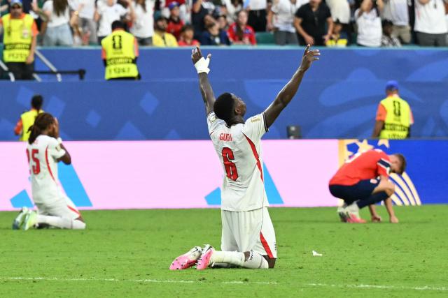 England's defender #06 Marc Guehi reacts after winning the 2026 World Cup football tournament quarter-final match between Norway and England at Miami Stadium in Miami Gardens on July 11, 2026.  (Photo by CHANDAN KHANNA / AFP)