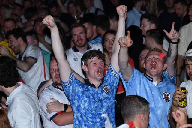 England fans celebrate England's victory after watching the 2026 World Cup quarter-final football match between England and Norway, at Camp and Furnace in Liverpool, north-west England early on July 12, 2026. (Photo by PETER POWELL / AFP)