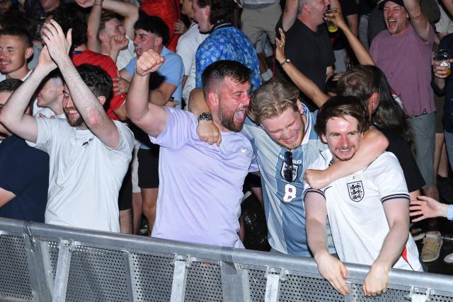 England fans celebrate England's victory after watching the 2026 World Cup quarter-final football match between England and Norway, at Camp and Furnace in Liverpool, north-west England early on July 12, 2026. (Photo by PETER POWELL / AFP)