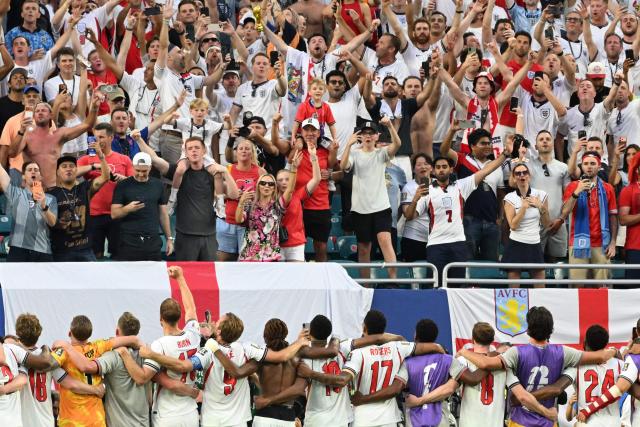 England's players celebrate in front of the fans the 2-1 victory over Norway at the end of the 2026 World Cup football tournament quarter-final match between Norway and England at Miami Stadium in Miami on July 11, 2026.  (Photo by ROBERTO SCHMIDT / AFP)