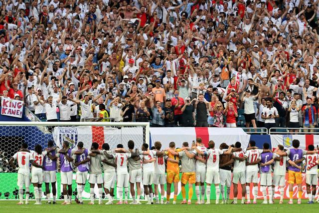 England's players celebrate with the fans after beating Norway 2-0 during the 2026 World Cup football tournament quarter-final match between Norway and England at Miami Stadium in Miami on July 11, 2026.  (Photo by ROBERTO SCHMIDT / AFP)