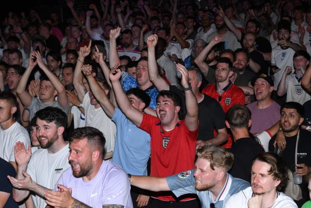 England fans celebrate England's victory after watching the 2026 World Cup quarter-final football match between England and Norway, at Camp and Furnace in Liverpool, north-west England early on July 12, 2026. (Photo by PETER POWELL / AFP)