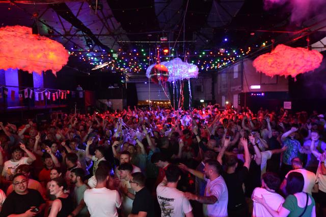 England fans celebrate England's victory after watching the 2026 World Cup quarter-final football match between England and Norway, at Camp and Furnace in Liverpool, north-west England early on July 12, 2026. (Photo by PETER POWELL / AFP)