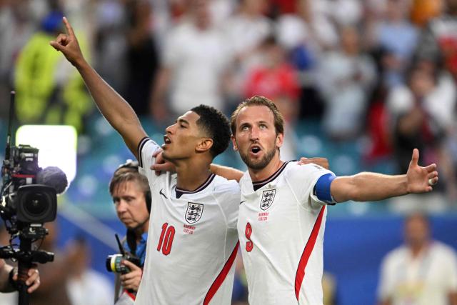 England's midfielder #10 Jude Bellingham and forward #09 Harry Kane celebrate after winning the 2026 World Cup football tournament quarter-final match between Norway and England at Miami Stadium in Miami Gardens on July 11, 2026.  (Photo by MAURO PIMENTEL / AFP)