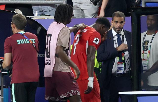 Switzerland's forward #07 Breel Embolo (C) reacts after he was sent off with a second yellow card during the 2026 World Cup football tournament quarter-final match between Argentina and Switzerland at the Kansas City Stadium in Kansas City on July 11, 2026.  (Photo by Thomas COEX / AFP)