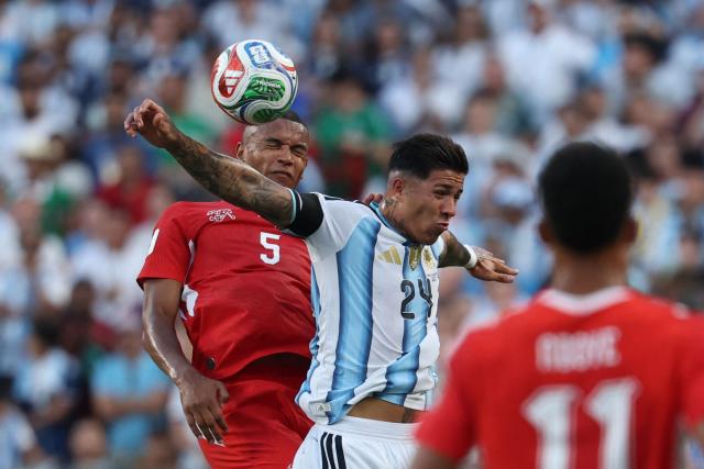 Argentina's midfielder #24 Enzo Fernandez and Switzerland's defender #05 Manuel Akanji jump for a header during the 2026 World Cup football tournament quarter-final match between Argentina and Switzerland at the Kansas City Stadium in Kansas City on July 11, 2026.  (Photo by Odd ANDERSEN / AFP)